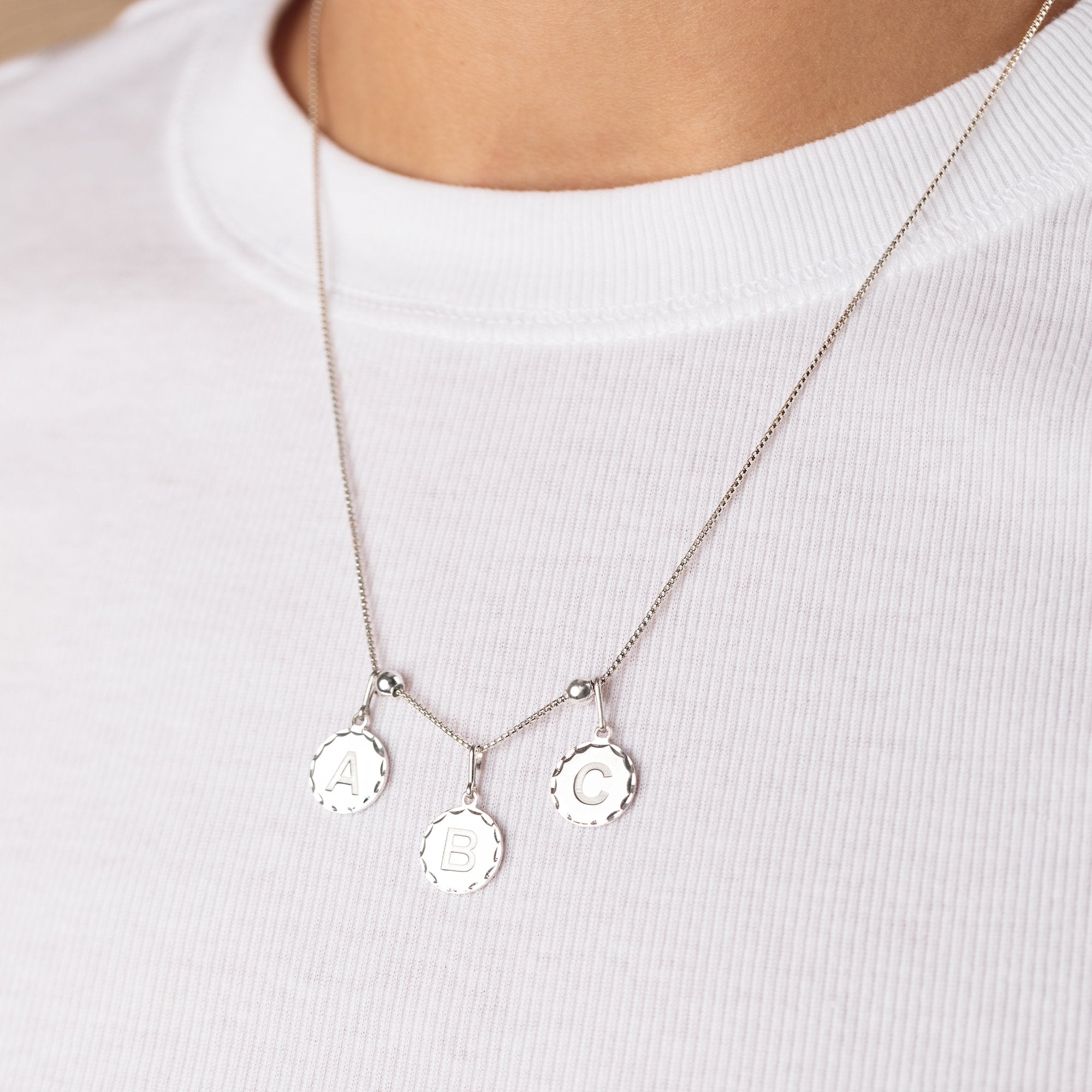 CS20INT01S-InitialCharmSilver-chainstation-HOLIDAY-ECOMM-ALTS_b8a924ab-9b96-426b-8eac-d0cff1eea68d.jpg